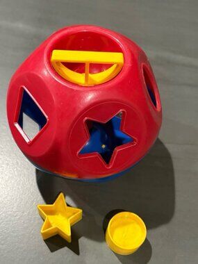 Tupperware ball with shapes